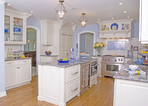 Blue Eyes with White Cabinets and Blue Mosaic Backsplash